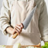 a person holding XINZUO B37 Lan Chef's Knife 8.5"