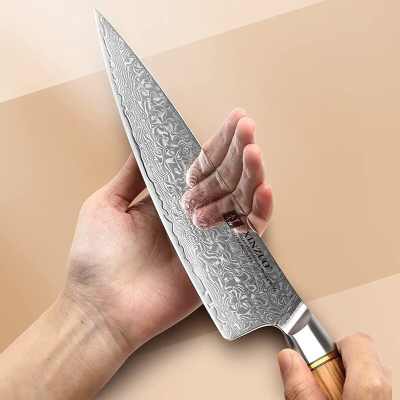 a person holding a XINZUO B37 Lan Chef's Knife 8.5"
