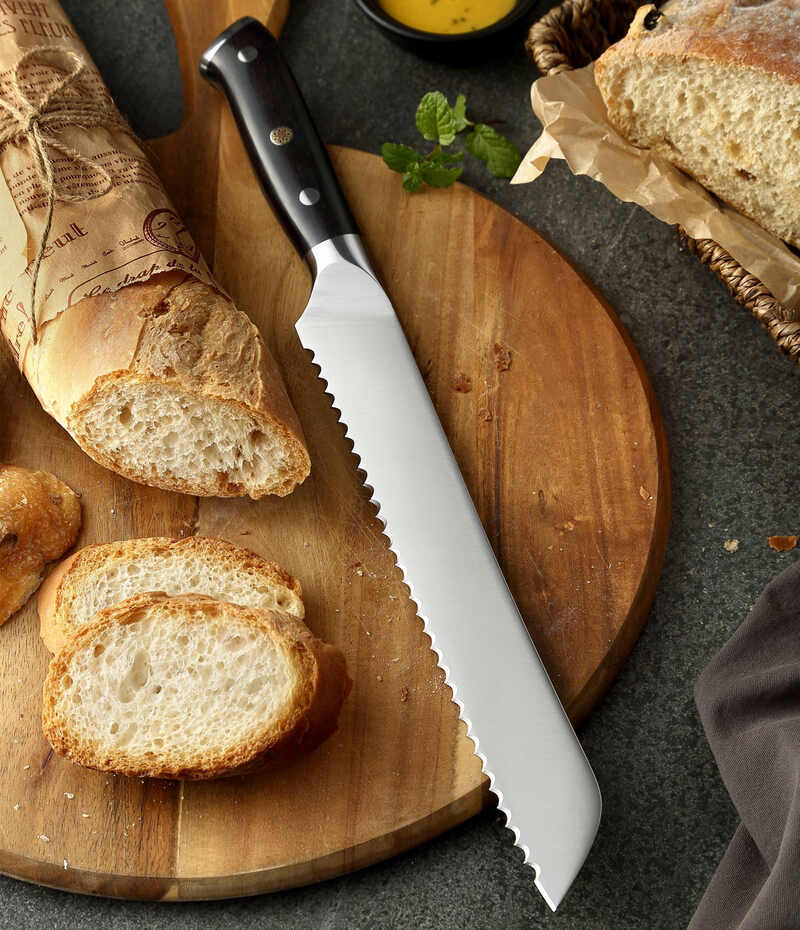 a XINZUO B13S Yu Bread Knife 9“ on a cutting board