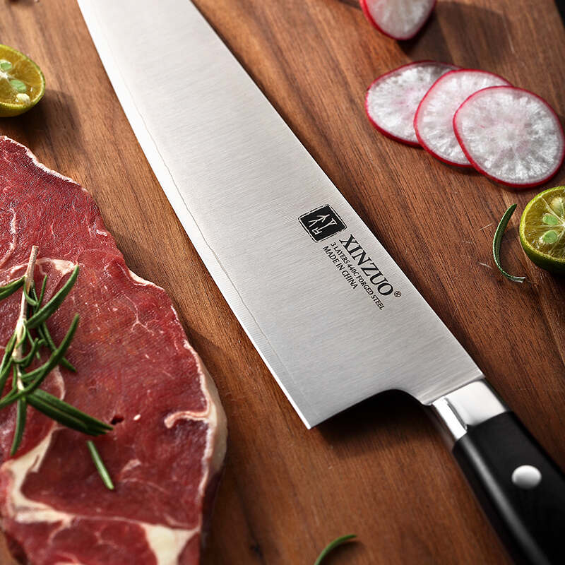 a XINZUO B9S-28 Chef‘s Knife 8“ next to a piece of meat