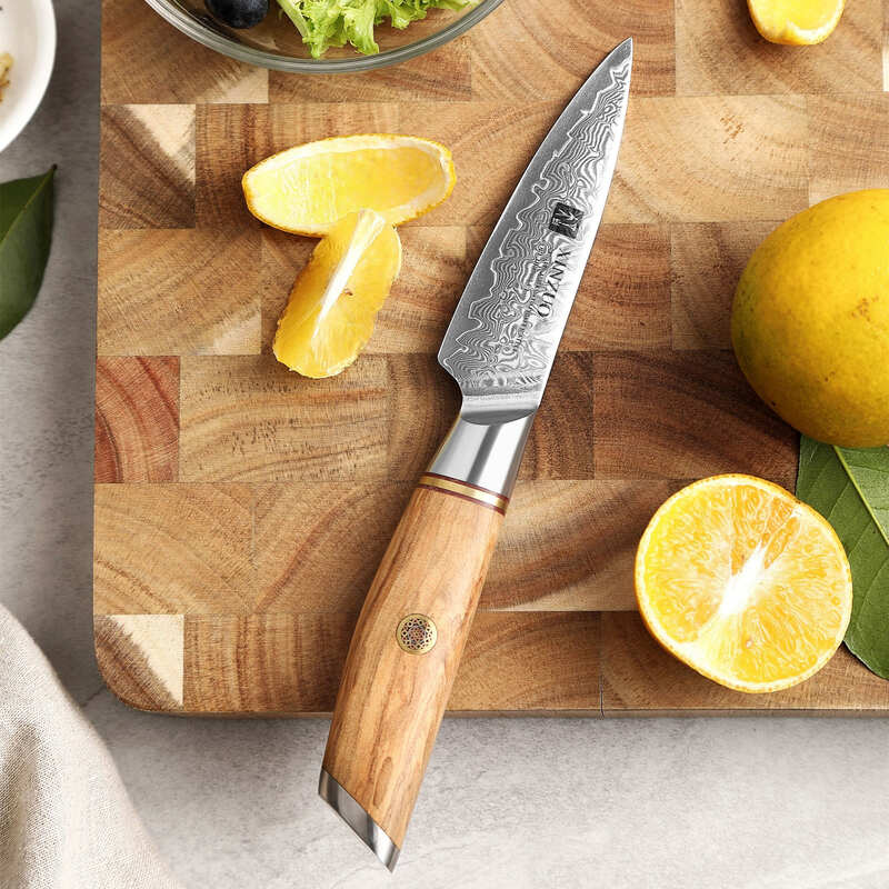 XINZUO B37 Lan Paring Knife 3.5” on a cutting board