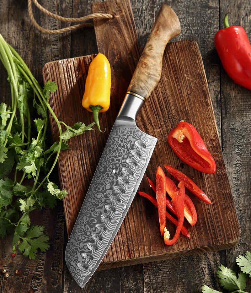 a HEZHEN B30 Santoku Knife 7“ on a cutting board next to peppers