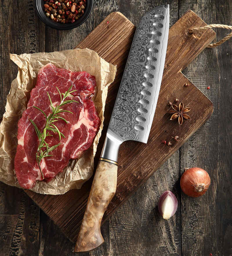 a HEZHEN B30 Santoku Knife 7“ and meat on a cutting board