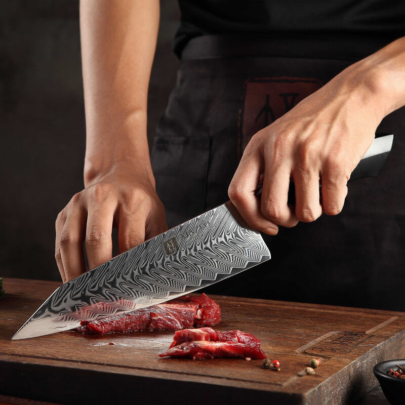 a person cutting meat on a cutting board