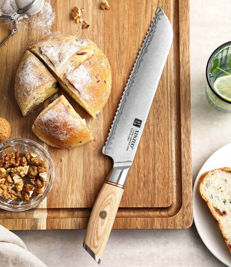 XINZUO B37S Lan Bread Knife 8.5“ on a cutting board with a bread loaf