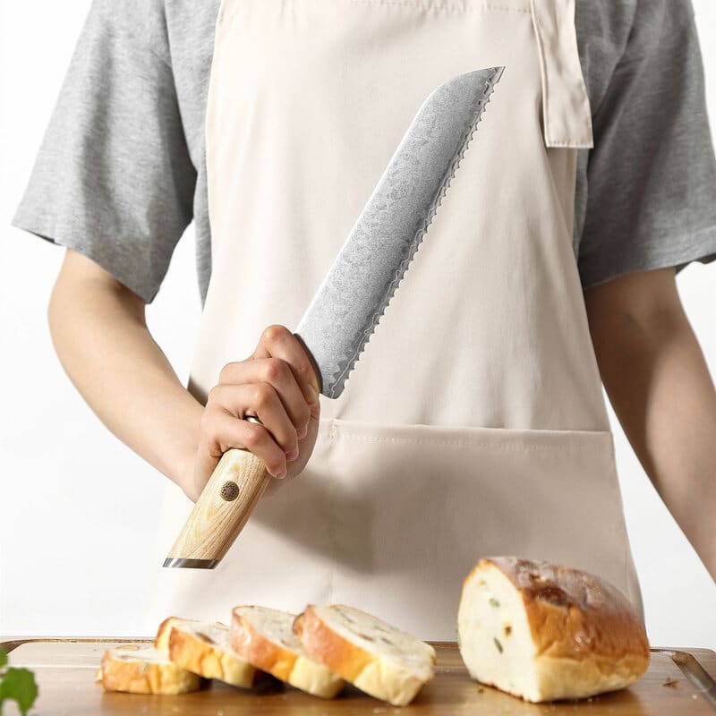 a person holding a XINZUO B37S Lan Bread Knife 8.5“